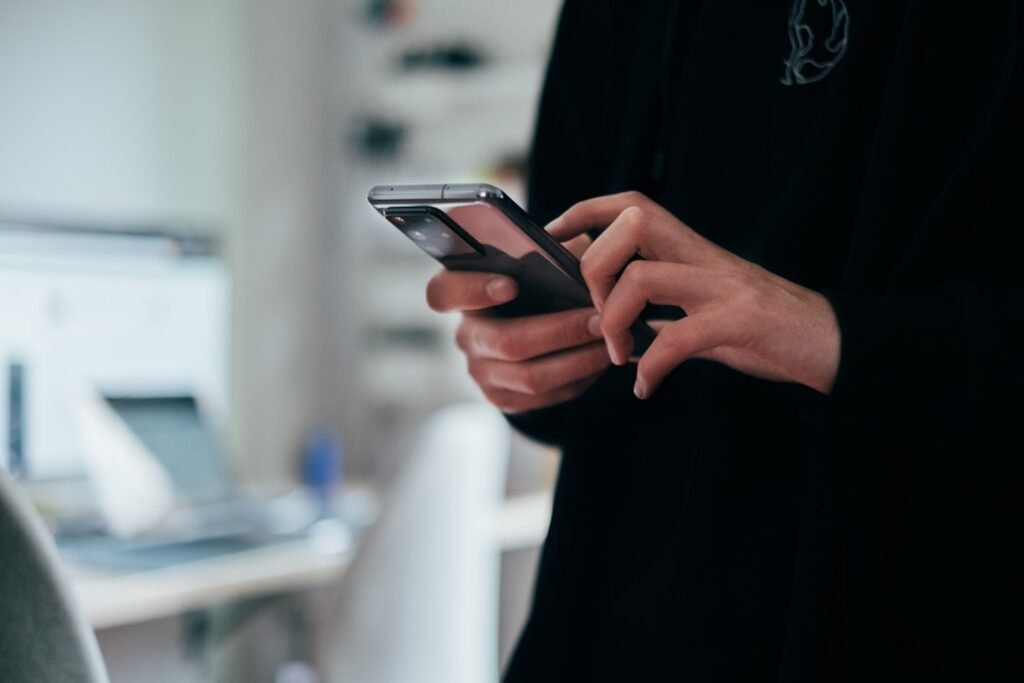 Person holding an Android smartphone before sharing it