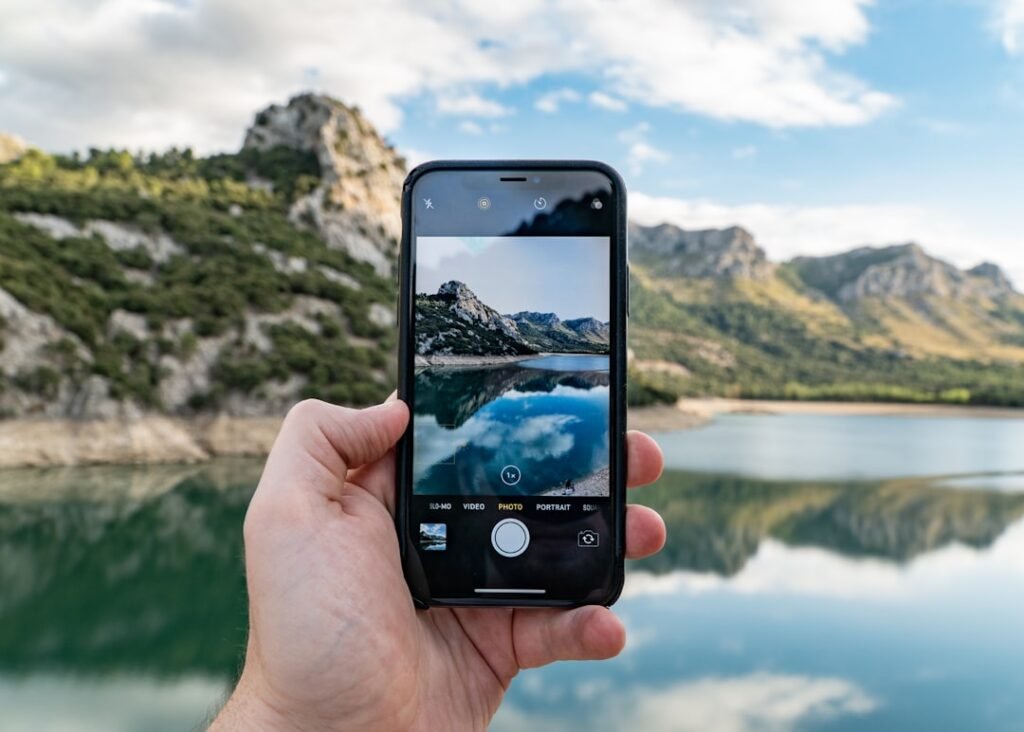 Person holding an iPhone while managing private photos