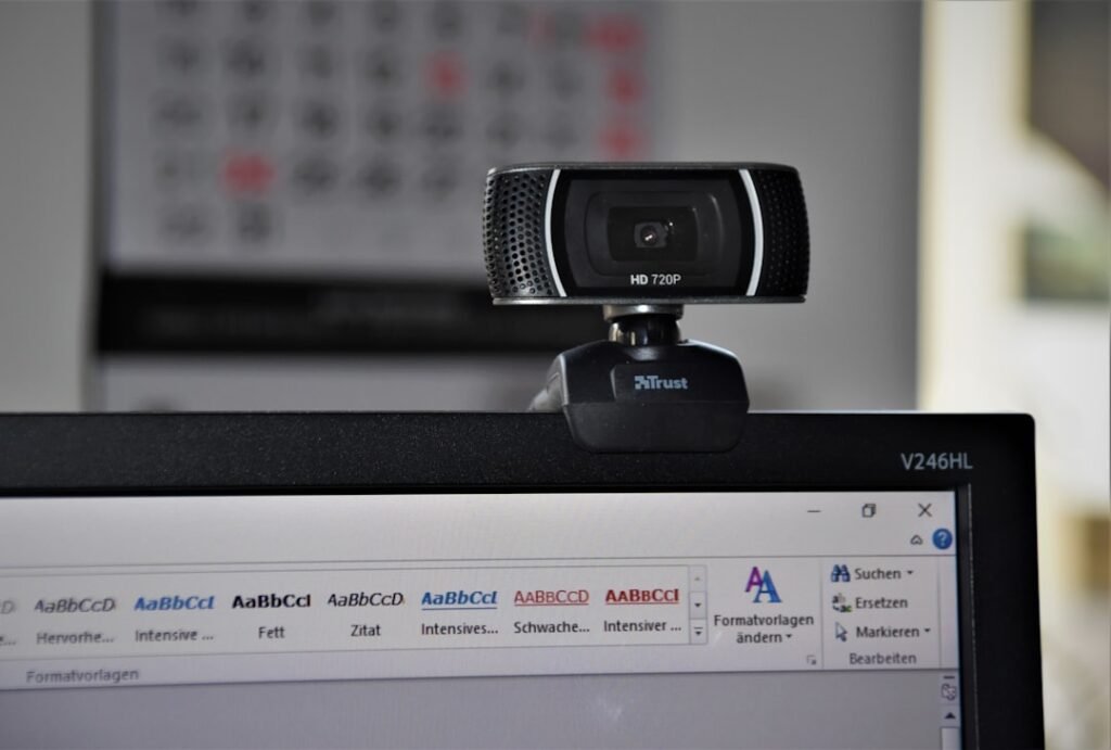 Laptop with webcam for reviewing camera and microphone permissions