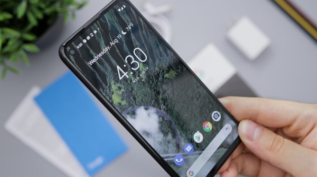 Person holding an Android smartphone while checking notifications