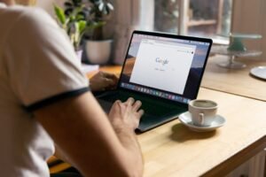 Person using Chrome on a laptop to manage website notifications