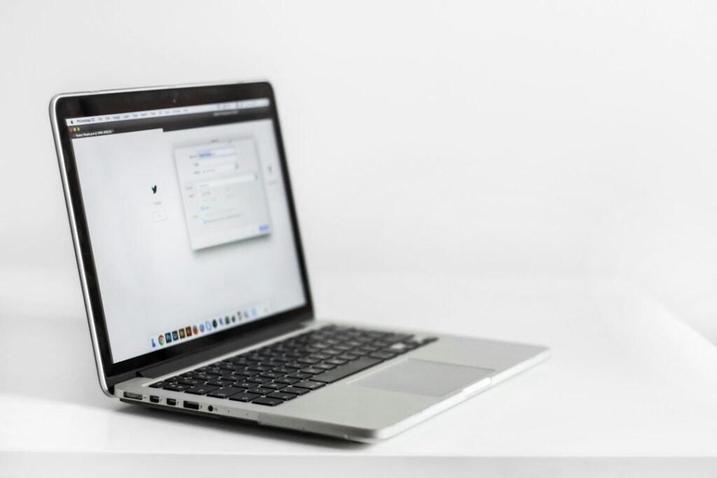 Laptop on an organized desk representing saved Chrome tab groups