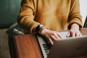 Person writing an email on a laptop before using Gmail Undo Send